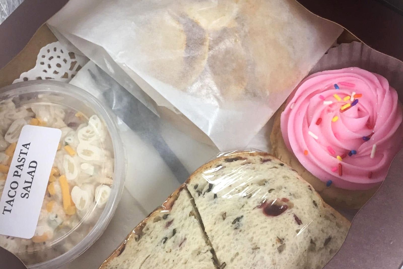 Boxed lunch with pasta salad and a cookie